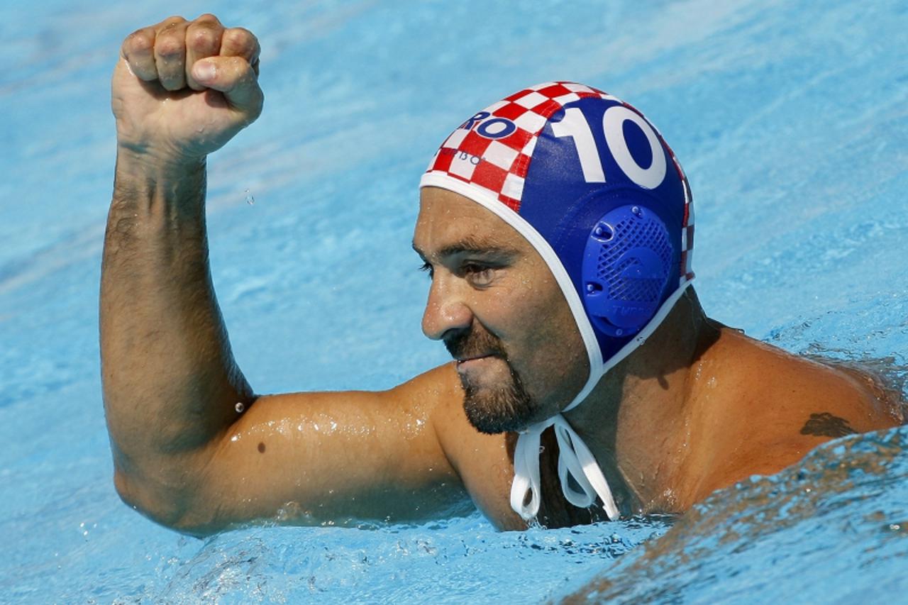 'Samir Barac of Croatia celebrates his goal during their preliminary match against Montenegro at the World Championships in Rome on July 22, 2009.REUTERS/Laszlo Balogh (ITALY SPORT WATER POLO)'