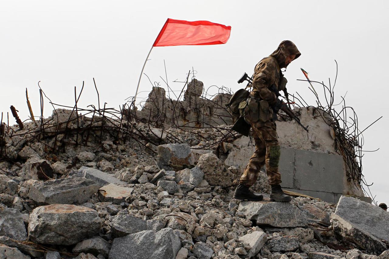 FILE PHOTO: A serviceman of the self-proclaimed Donetsk People’s Republic walks at the damaged war memorial complex Savur-Mohyla during a ceremony marking the 75th anniversary of the liberation of the Donbas region during World War Two, outside Donetsk