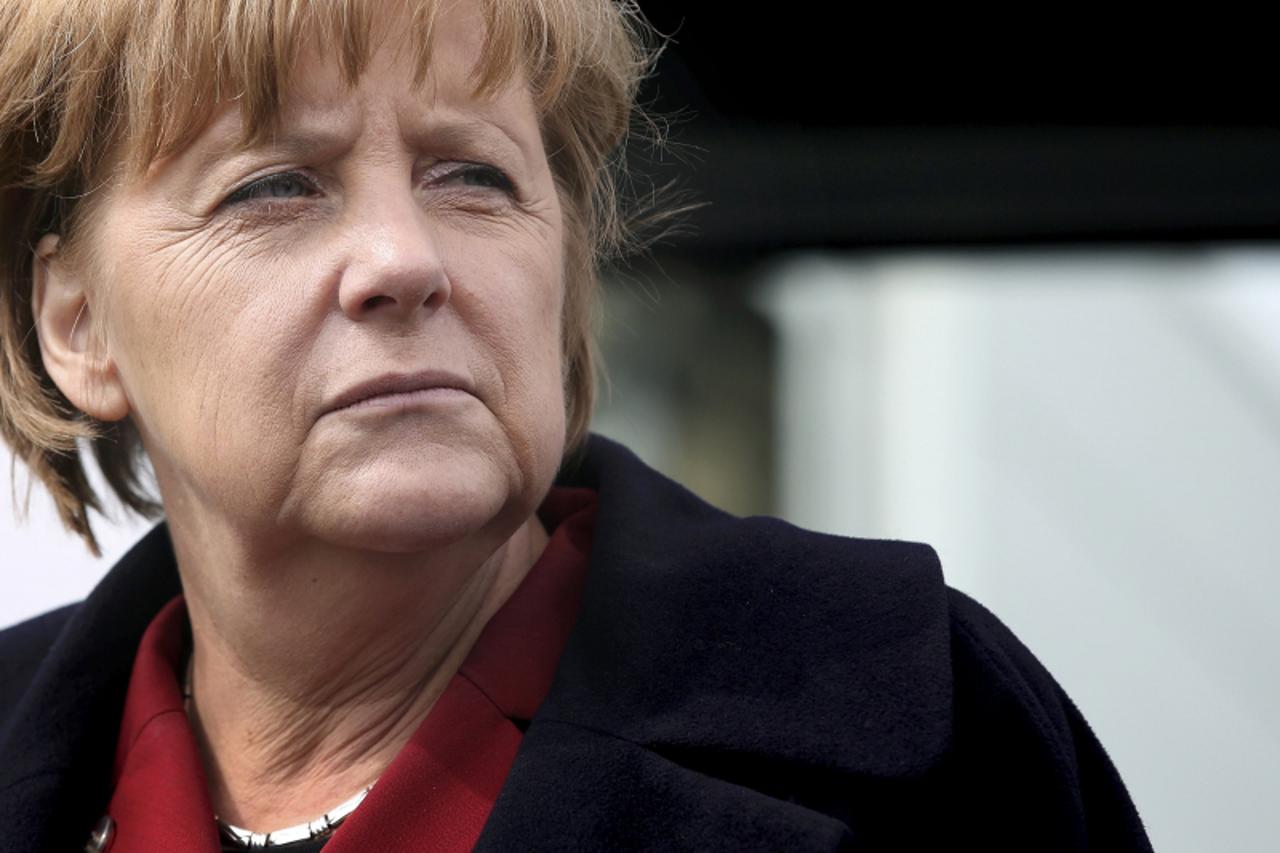 'German Chancellor Angela Merkel visits the public transport company PVGS Personenverkehrsgesellschaft mbH in Salzwedel, eastern Germany, April 12, 2013. REUTERS/Ronny Hartmann/Pool  (GERMANY  - Tags: