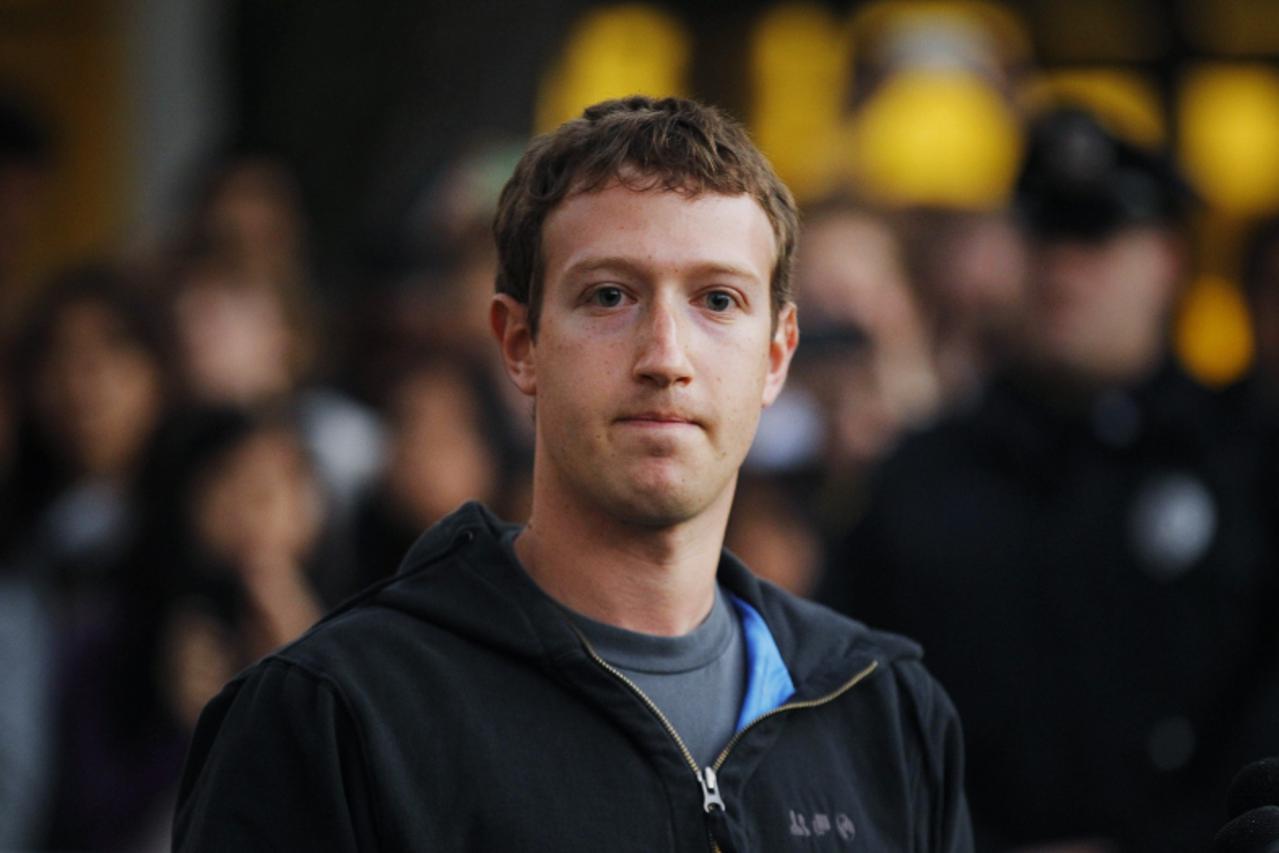 'Facebook founder and CEO Mark Zuckerberg speaks to reporters at Harvard University in Cambridge, Massachusetts November 7, 2011.  Zuckerberg is visiting MIT and Harvard to recruit students about to g