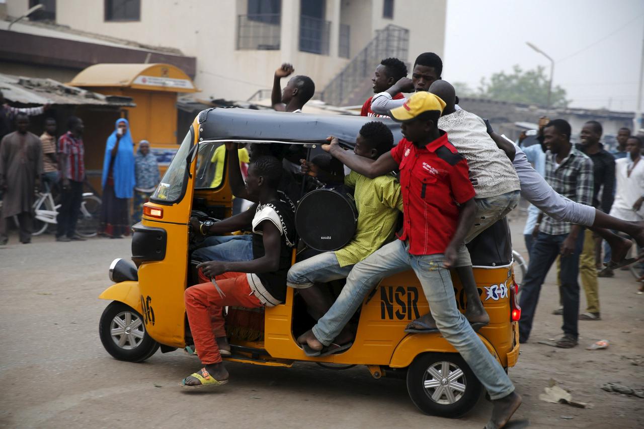 Supporters jubilate along a street after All Progressive Congress (APC) candidate Muhammadu Buhari is pronounced the winner of Nigeria's presidential election, in Kano March 31, 2015. Three decades after seizing power in a military coup, Buhari became the