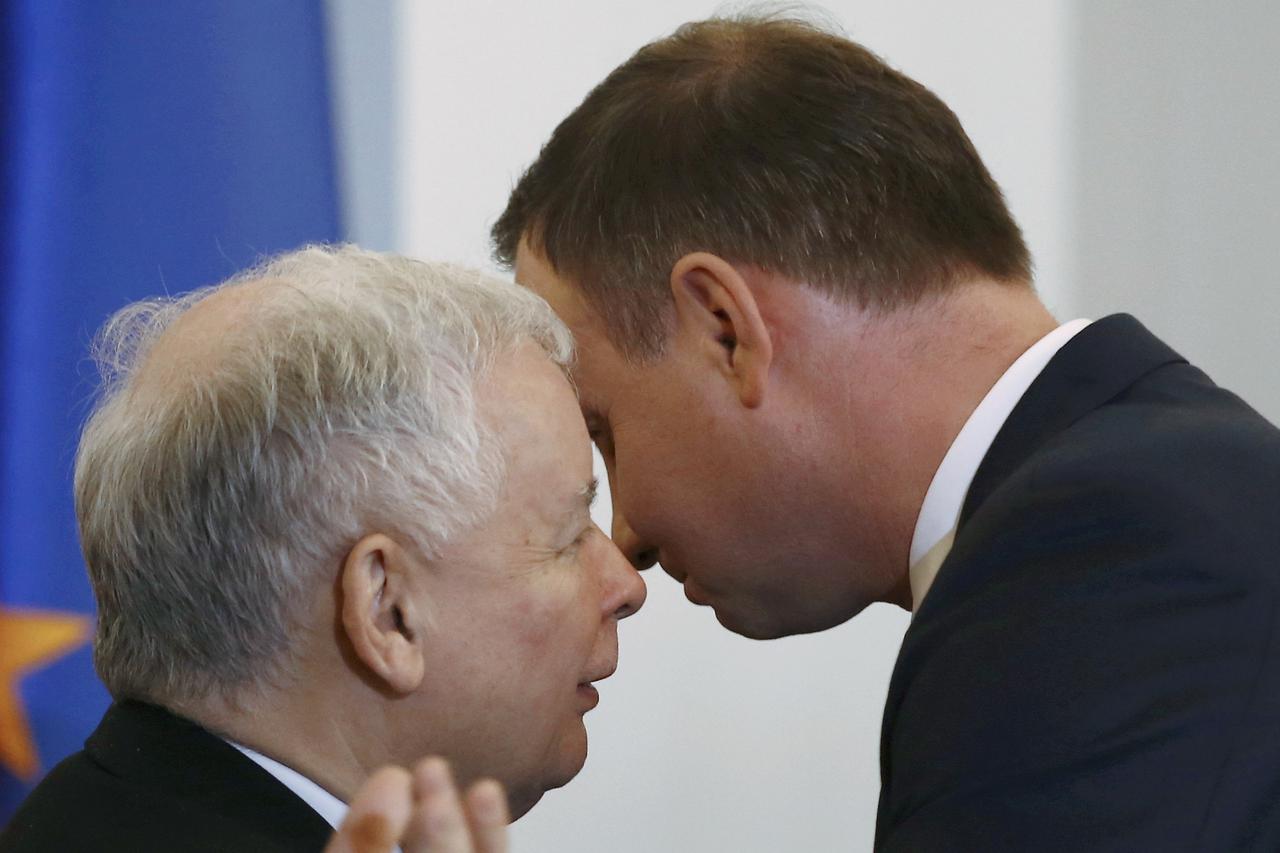 FILE PHOTO: Kaczynski, leader of PiS party, speaks with Poland's President Duda during after Szydlo was designated for the position of prime minister, at the Presidential palace in Warsaw