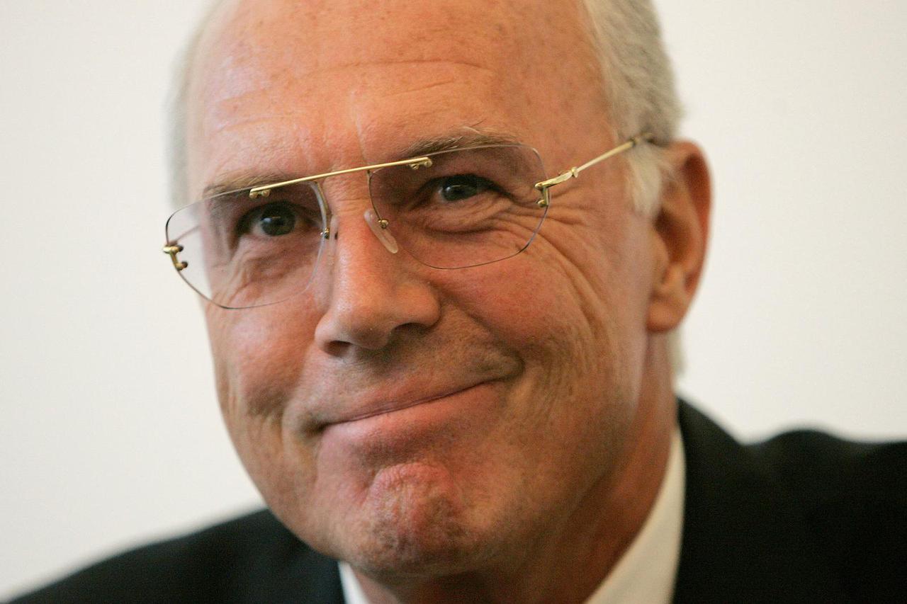 FILE PHOTO: Beckenbauer smiles during a Prize Herbert news conference in Interlaken