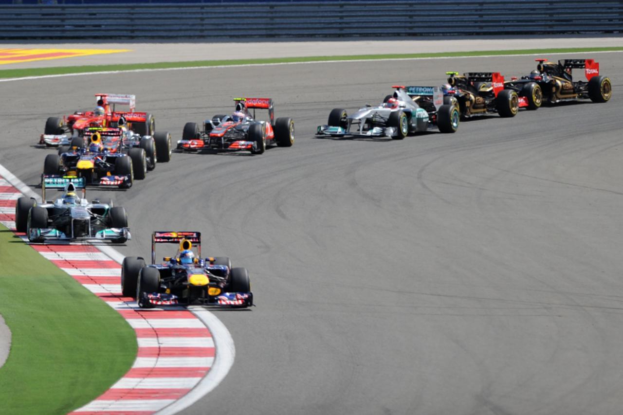 'Red Bull Racing\'s German driver Sebastian Vettel leads after the start of the at Istanbul Park on May 8, 2011 in Istanbul during the Turkish Formula One Grand Prix.  AFP PHOTO / Tom Gandolfini '