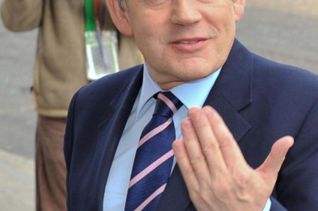 'British Prime Minister Gordon Brown arrives for a press conference in central London, on April 19, 2010. Britain is dispatching Navy ships to help bring home its nationals stranded by the closure of 