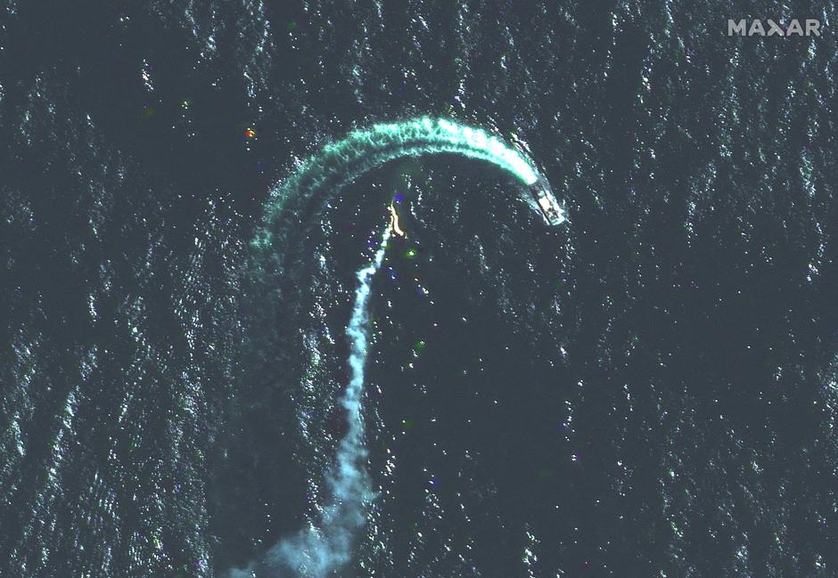 A satellite image shows a Serna-class landing craft and possible missile contrail near Snake Island
