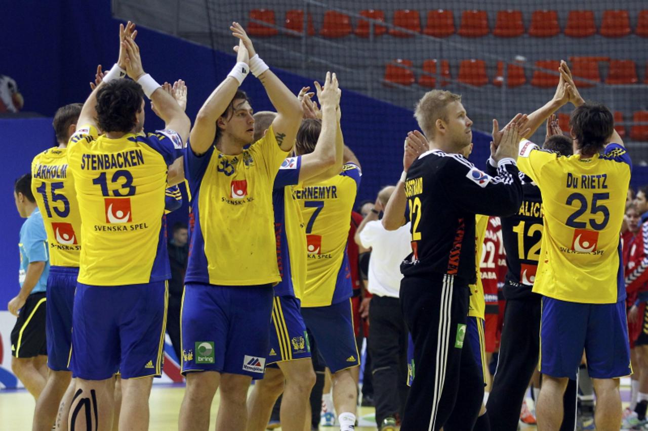 'Sweden\'s players celebrate their victory against the Czech Republic during their men\'s European Handball Championship Group B match in Nis January 17, 2012. REUTERS/Stoyan Nenov (SERBIA  - Tags: SP