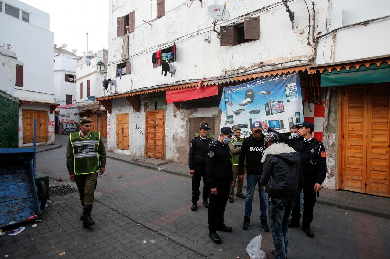 FILE PHOTO: Police officers patrol streets in the old Medina in Casablanca