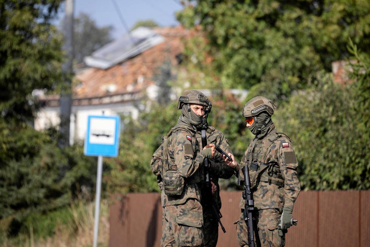 Soldiers patrol the street, following violations of Polish airspace during a Russian attack on Ukraine, in Wyryki-Polod