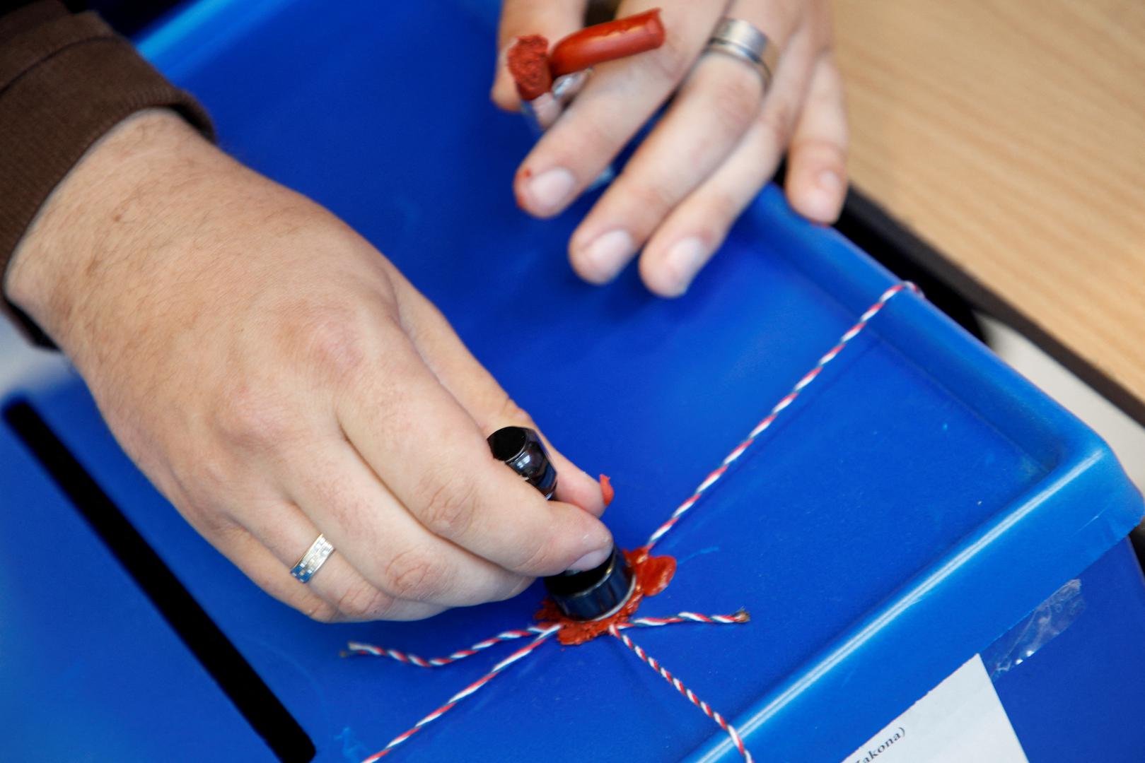 A member of the electoral commission seals a ballot box at a polling station during the presidential elections in Podgorica, Montenegro, March 19, 2023. REUTERS/Stevo Vasiljevic Photo: STEVO VASILJEVIC/REUTERS