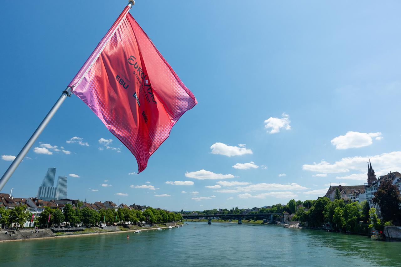 A flag flutters over the Muenster and the Rhine river during the Eurovision Song Contest in Basel