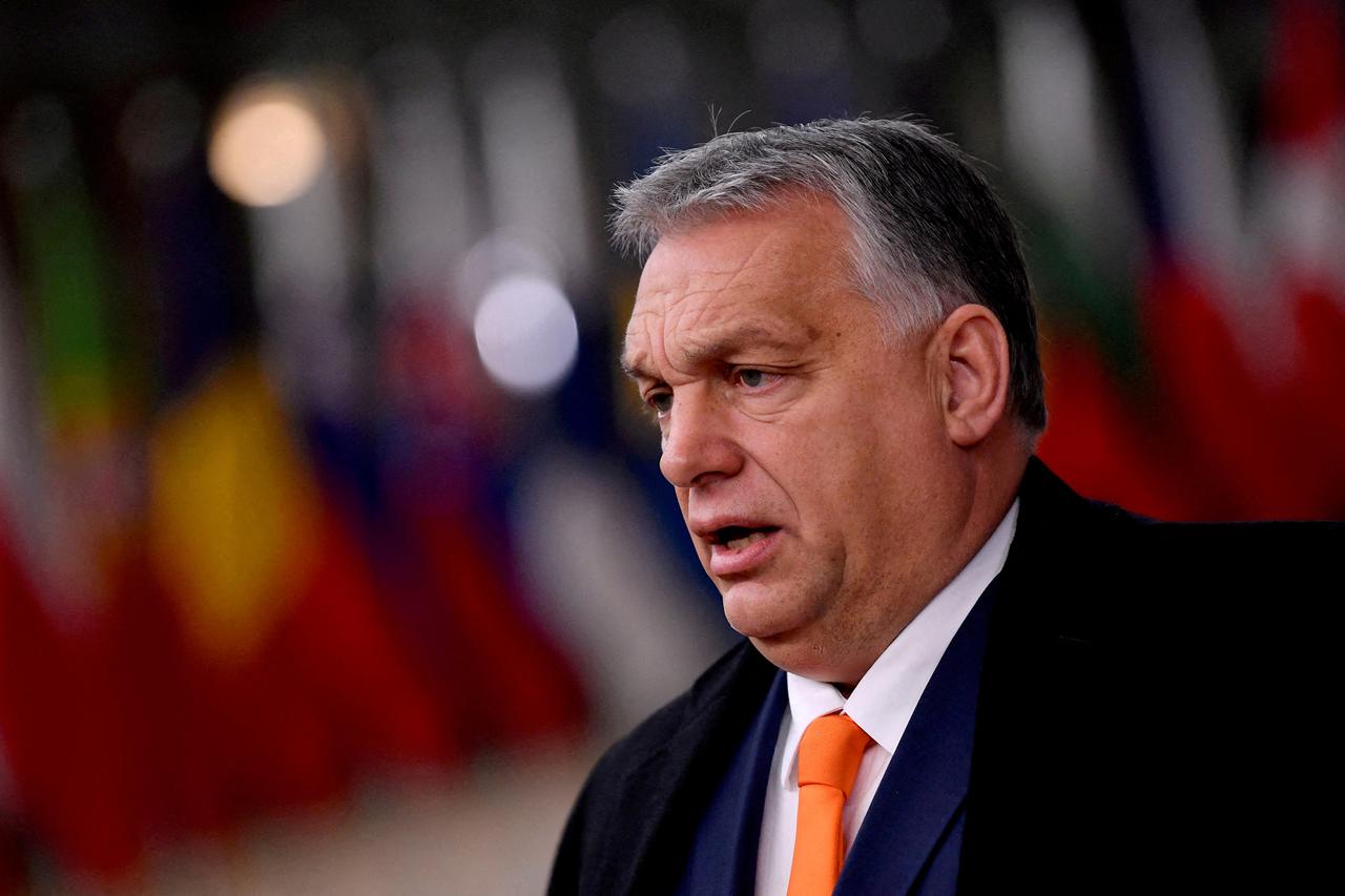 FILE PHOTO: Hungarian Prime Minister Viktor Orban speaks on arrival for an EU summit in Brussels