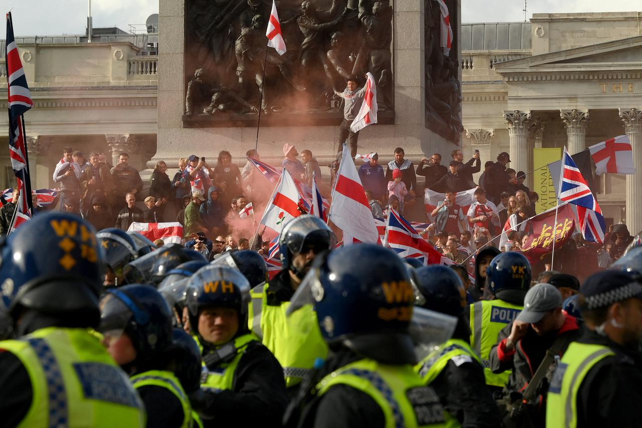Anti-immigration activist Tommy Robinson leads rally in central London