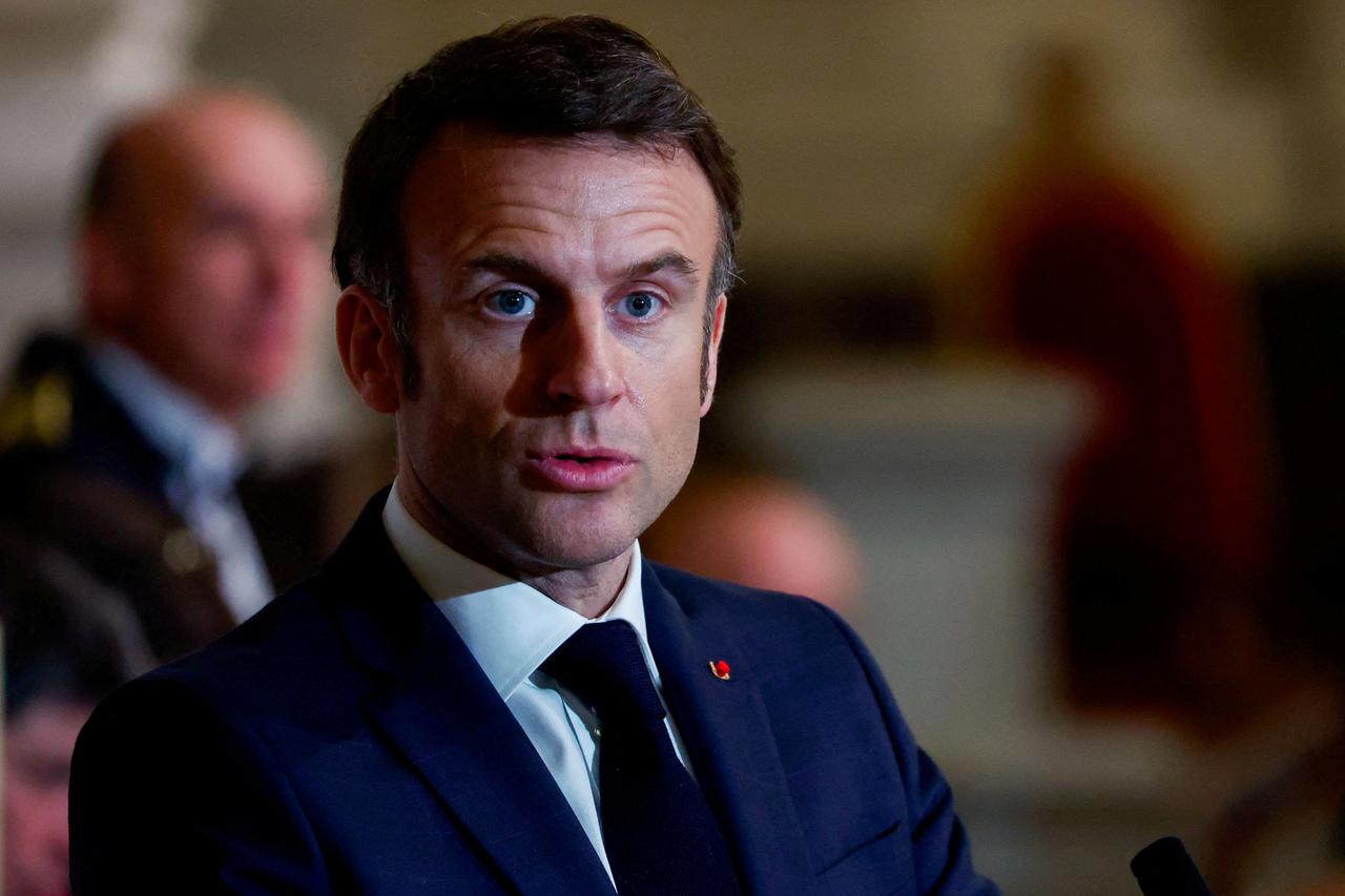 FILE PHOTO: French President Macron and Lithuania's President Nauseda speak before a concert at Saint-Louis des Invalides cathedral in Paris