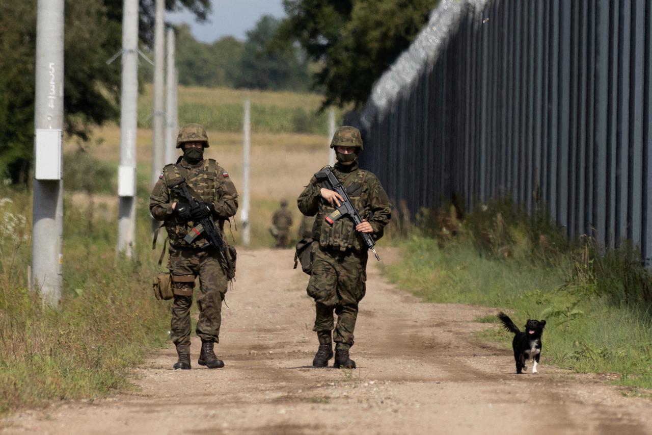 FILE PHOTO: Polish soldiers patrol the Polish-Belarusian border
