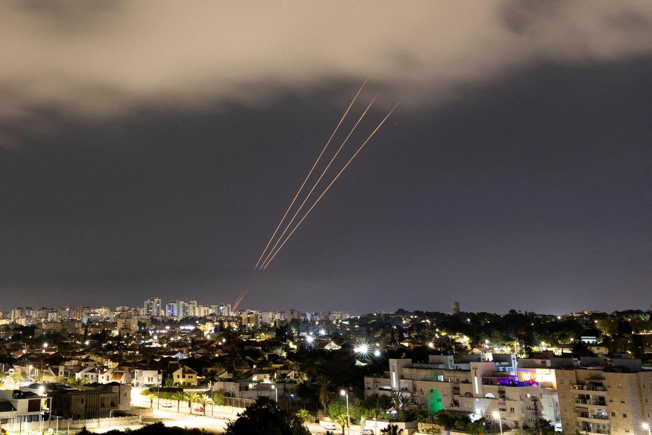 FILE PHOTO: An anti-missile system operates after Iran launched drones and missiles towards Israel, as seen from Ashkelon