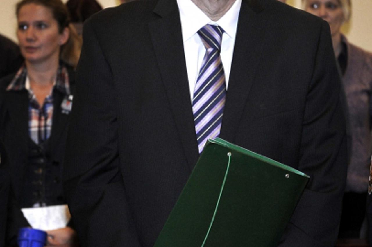 \'Former Croatian Prime Minister Ivo Sanader stands at the beginning of his trial in Zagreb, on November 3, 2011. The corruption trial of former Croatian prime minister, which was postponed for today 