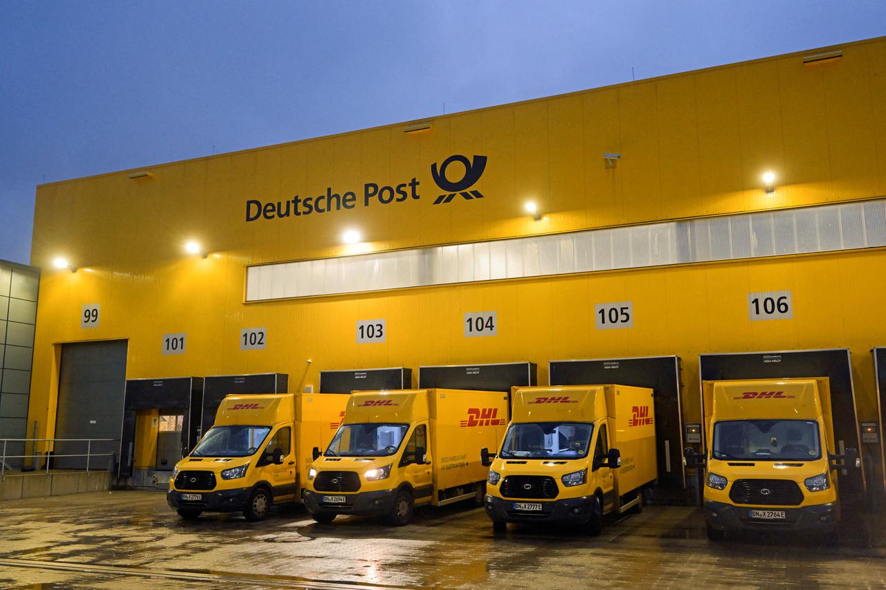 FILE PHOTO: Employees work at a distribution centre of Deutsche Post DHL in Hamburg