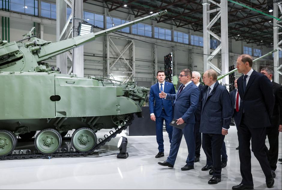 Russian President Vladimir Putin tours the exhibition of weapons and military equipment as he visits Motovilikha Plants in Perm