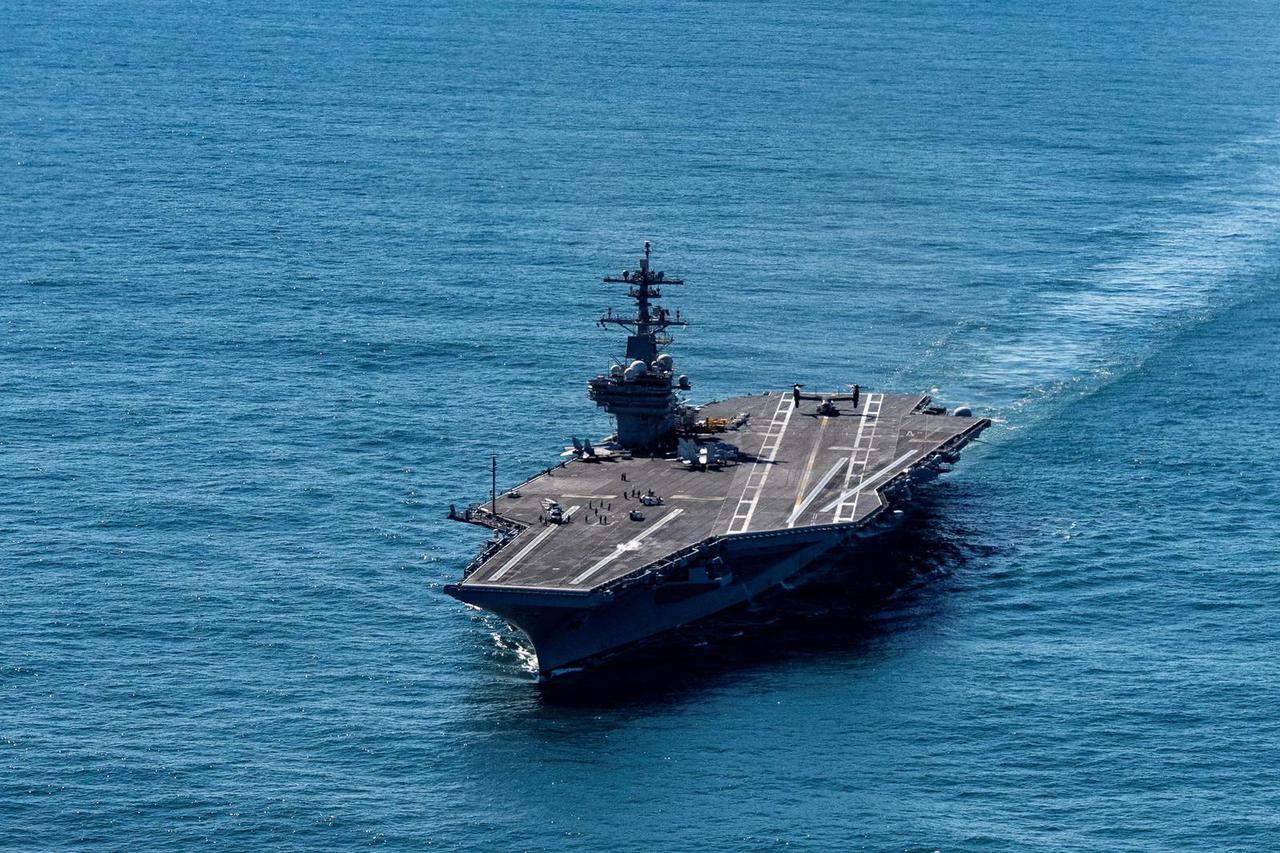The USS George H.W. Bush aircraft carrier sails in the Atlantic Ocean off the coast of Norfolk