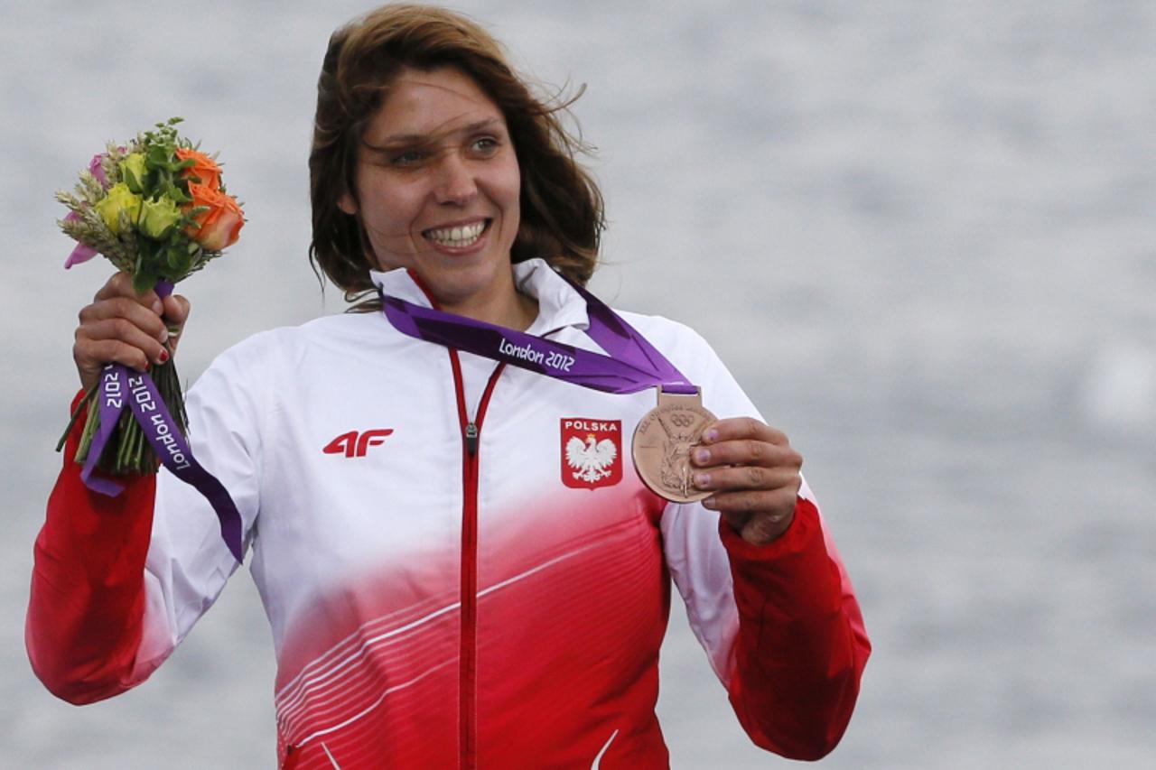 'Poland\'s Zofia Noceti-Klepacka poses with her bronze medal for the women\'s RS-X sailing class during the victory ceremony at the London 2012 Olympic Games in Weymouth and Portland, southern England
