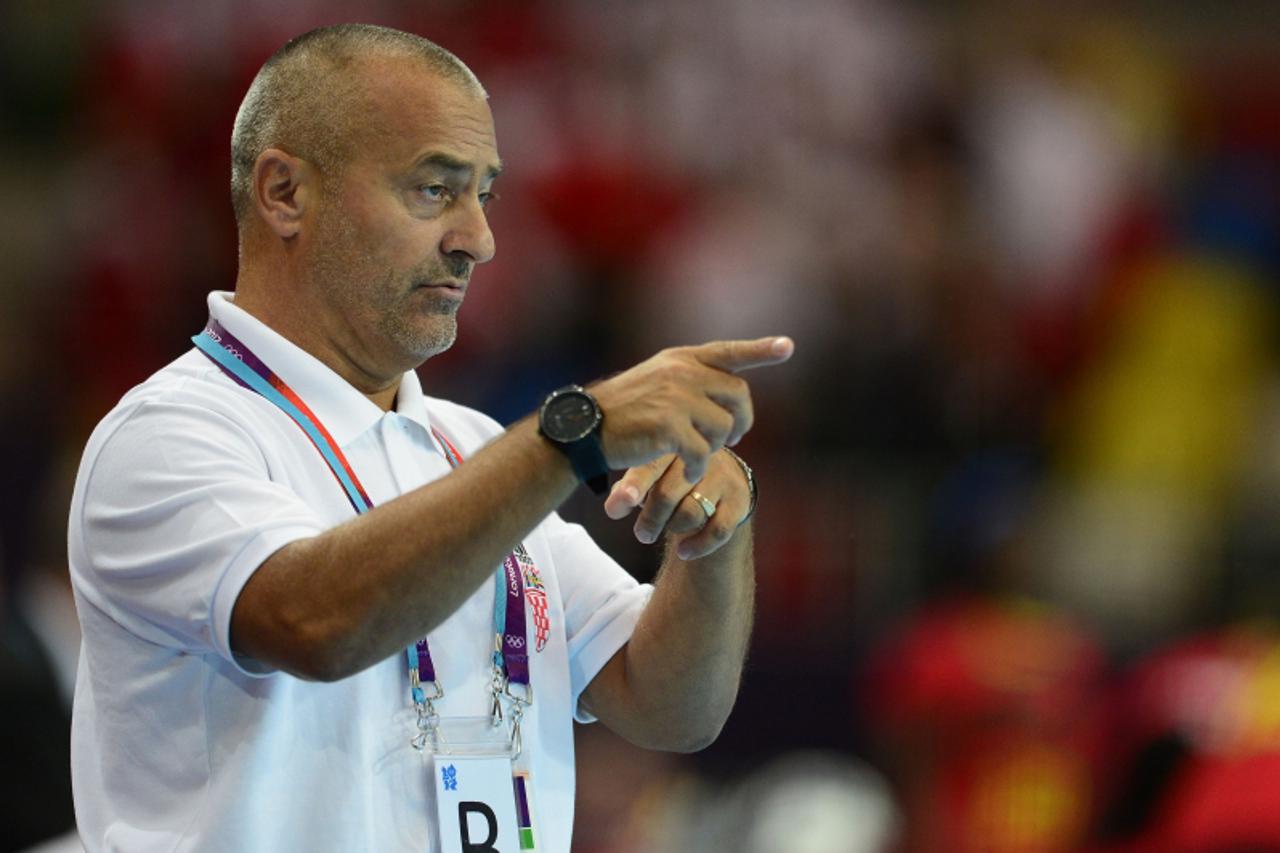 'Croatia\'s coach Vladimir Canjuga gestures during the women\'s preliminaries Group A handball match Angola vs Croatia for the London 2012 Olympics Games on July 30, 2012 at the Copper Box hall in Lon