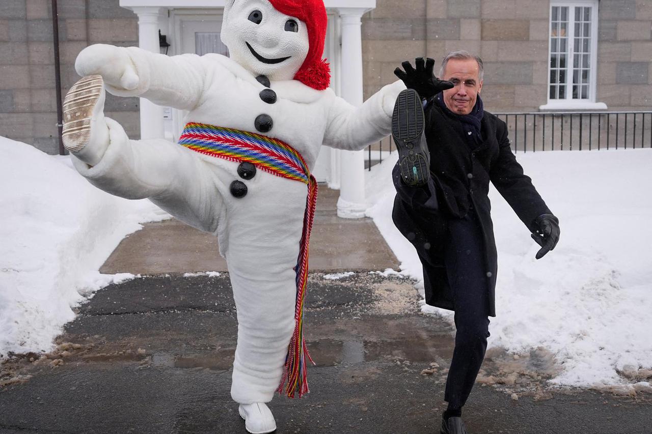 Canada's Prime Minister Mark Carney meets Bonhomme Carnaval, in Quebec City
