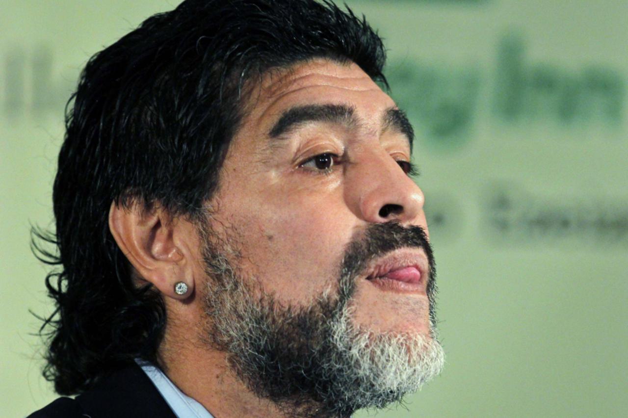 'Argentina soccer great Diego Maradona arrives to read a statement in Buenos Aires in this July 28, 2010 file photo. Maradona was named head coach of Dubai's Al Wasl Sport Club on May 16, 2011, in a 