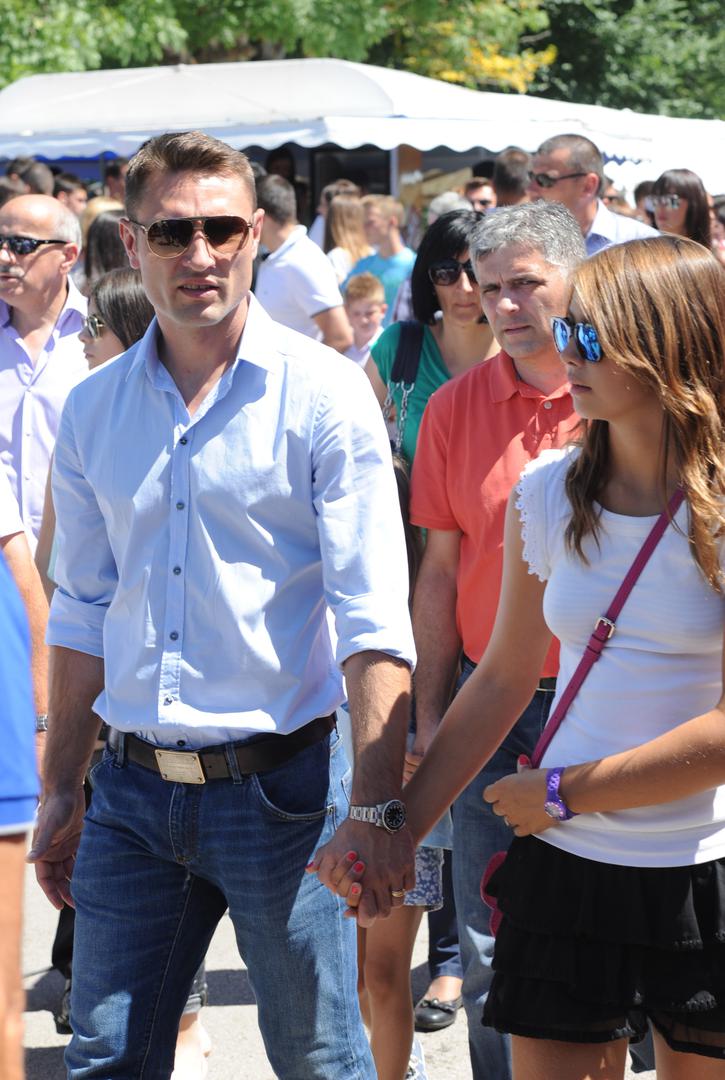 15.08.2014., Tomislavgrad - Robert i Anica Kovac s djecom na proslavi blagdana Velike Gospe u crkvi Uznesenja Blazene Djevice Marije u Seonici kod Tomislavgrada. Robert i Leticija Kovac. PRI KORISTENJU FOTOGRAFIJE ZASTITITI IDENTITET MALOLJETNIKA! (ZAMUTITI LICE). "nPhoto: Hrvoje Jelavic/PIXSELL