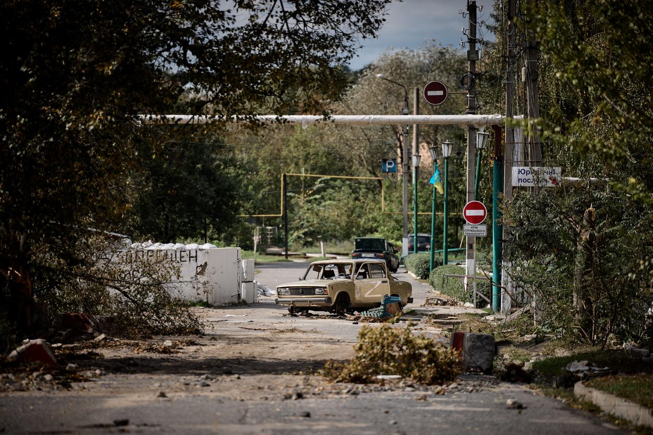 Damaged car with a letter 'Z' in seen in the recently liberated town of Kupiansk