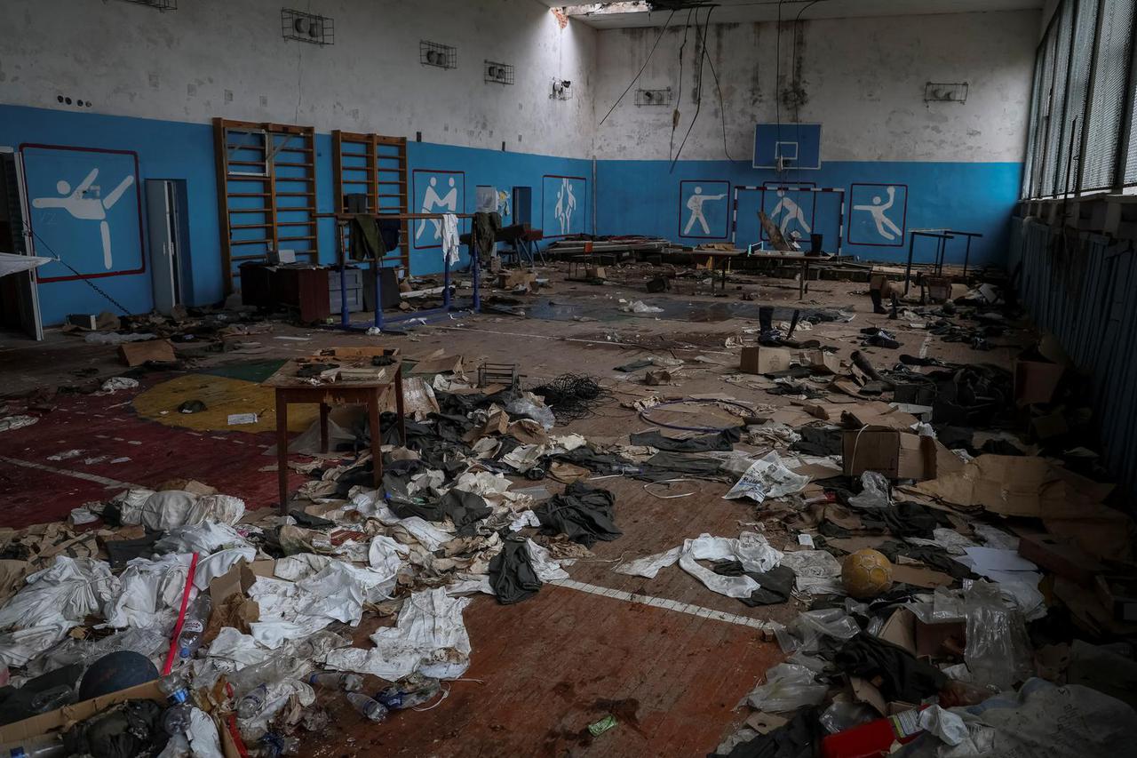 Russian abandoned uniforms are seen in the school gym in the village of Nova Husarivka