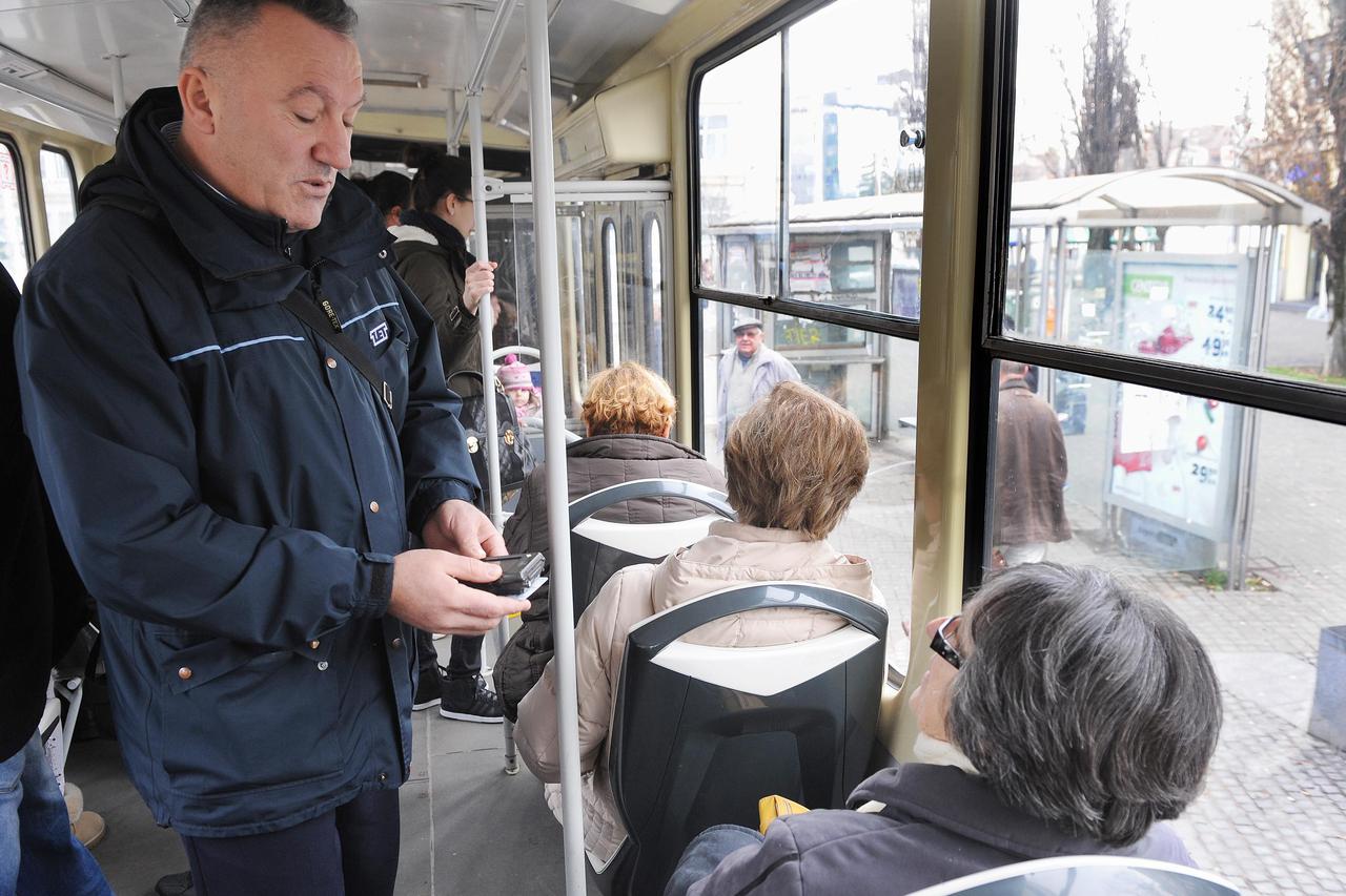 10.01.2013., Zagreb -  Reportaza o kontrolorima ZET-a. Kontrolori Zeljko Marinovic i Davor Guja pregledavali su karte putnika u tramvajima.  Photo: Davor Visnjic/PIXSELL