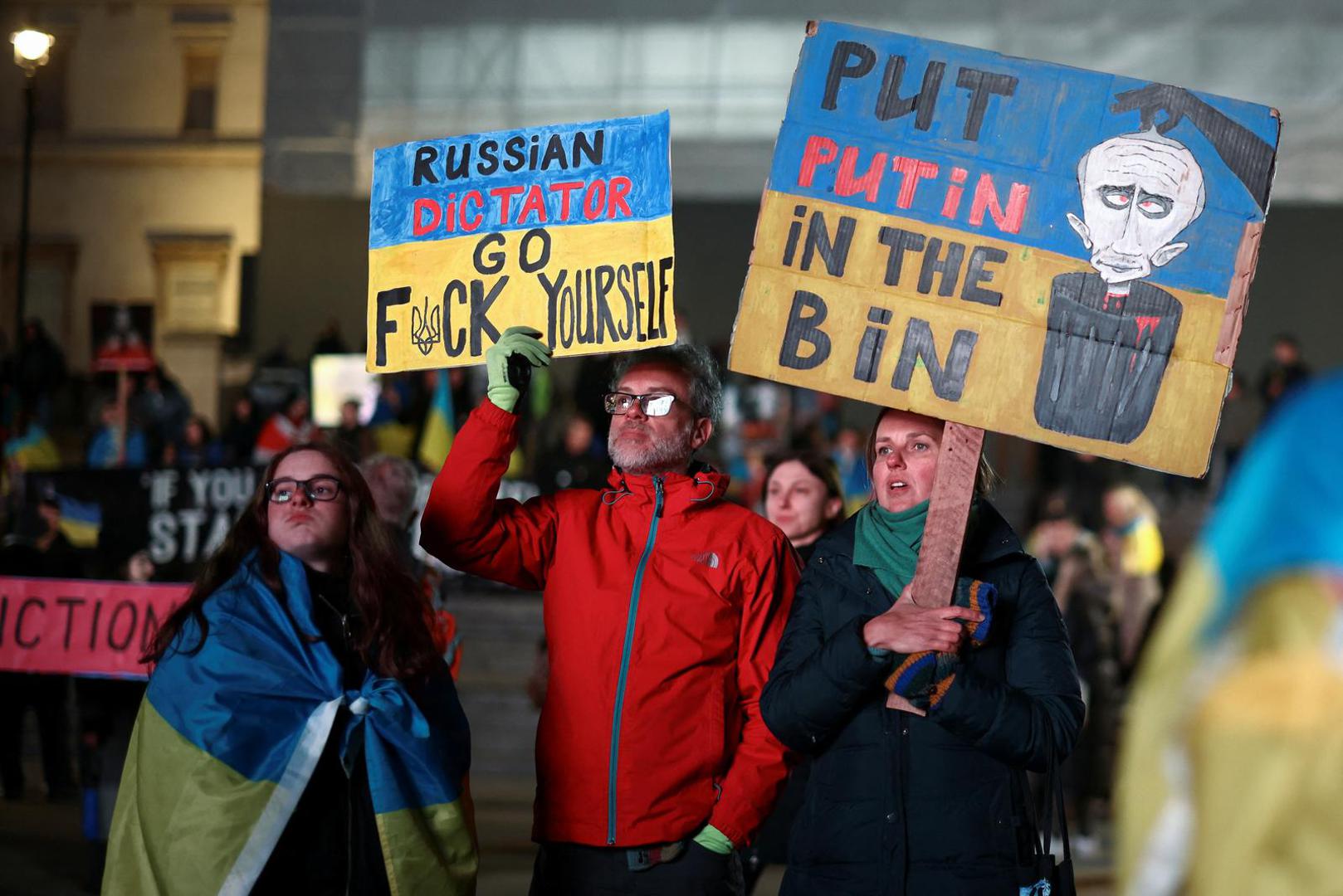 SENSITIVE MATERIAL. THIS IMAGE MAY OFFEND OR DISTURB    People attend a vigil for Ukraine held on the anniversary of the conflict with Russia, at Trafalgar Square in London, Britain February 23, 2023. REUTERS/Henry Nicholls Photo: Henry Nicholls/REUTERS