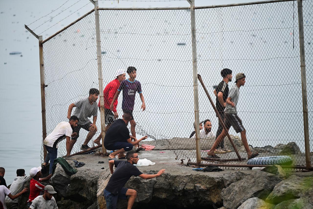 Migrants from Morocco arrive at the Spanish border in Ceuta