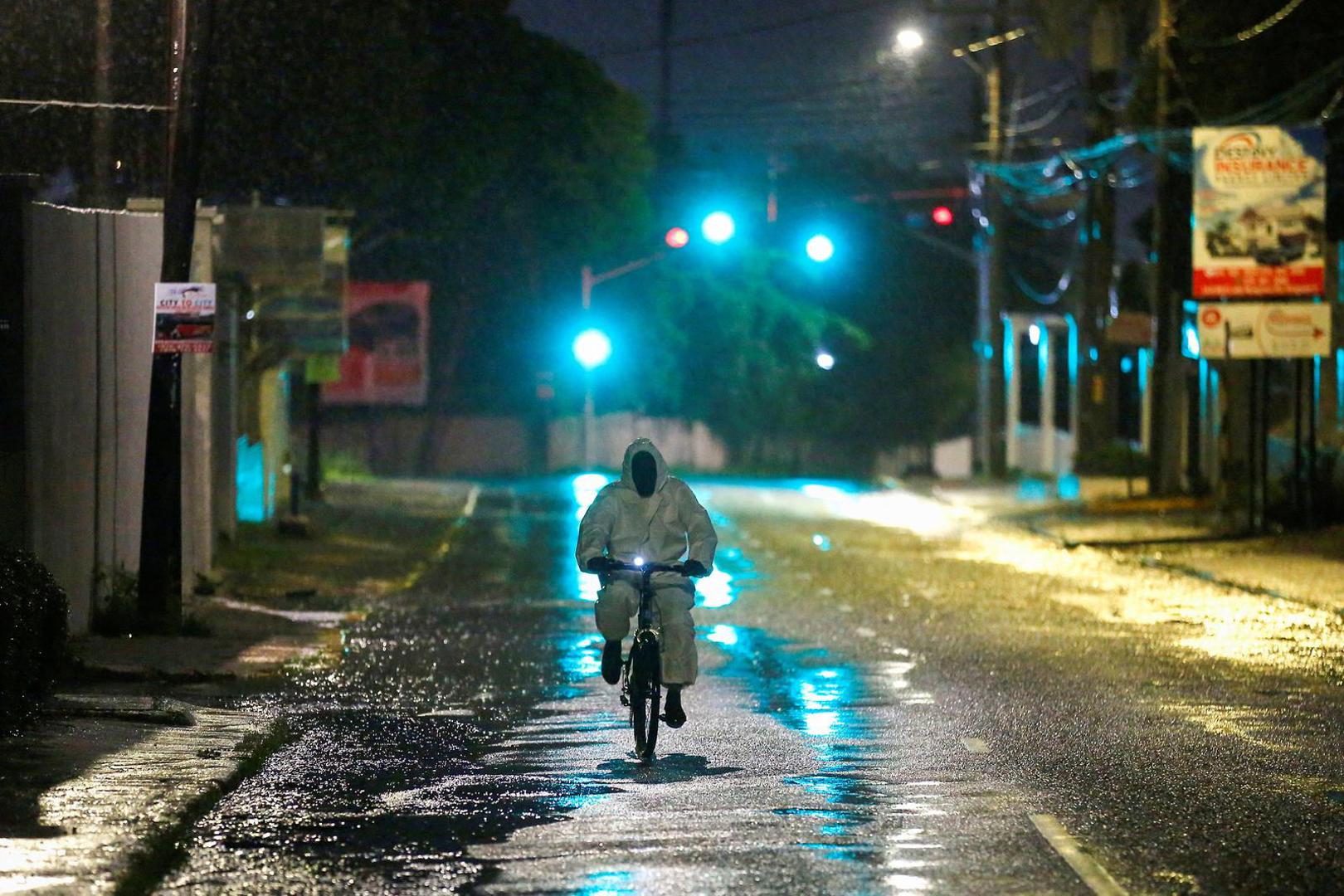 A man wearing a protective suit cycles on a street, as Hurricane Melissa approaches, in Kingston, Jamaica, October 27, 2025.  REUTERS/Octavio Jones Photo: OCTAVIO JONES/REUTERS