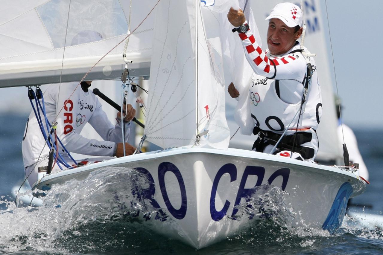 'Sime Fantela and Igor Marenic (R) of Croatia competing in the 470 men\'s class round the down windward mark during the first race of the sailing competition at the Beijing 2008 Olympic Games in Qingd