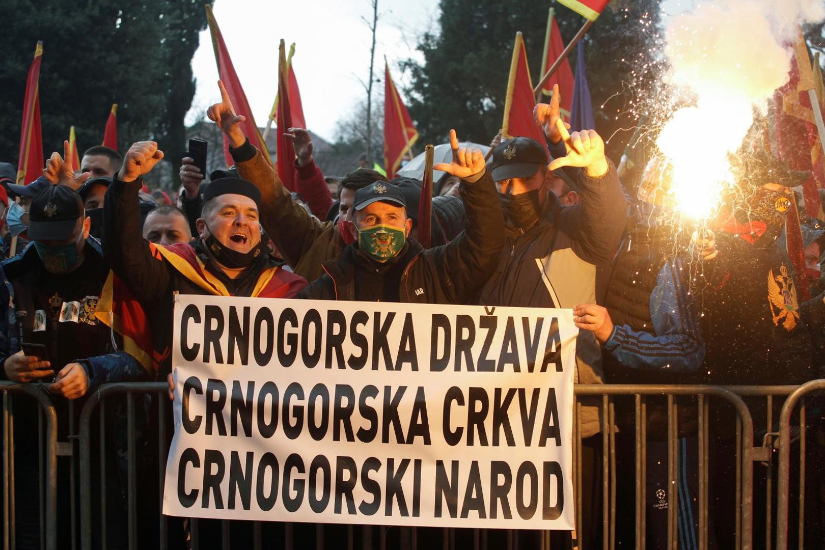 Protestors shout slogans during a rally ahead of a vote for the amendments of Law on Religious Freedoms, in Podgorica Protestors shout slogans during a rally ahead of a vote for the amendments of Law on Religious Freedoms, in front of parliament in Podgorica, Montenegro, December 28, 2020. Banner reads: "Montenegrin state, Montenegrin church, Montenegrin people". REUTERS/Stevo Vasiljevic STEVO VASILJEVIC
