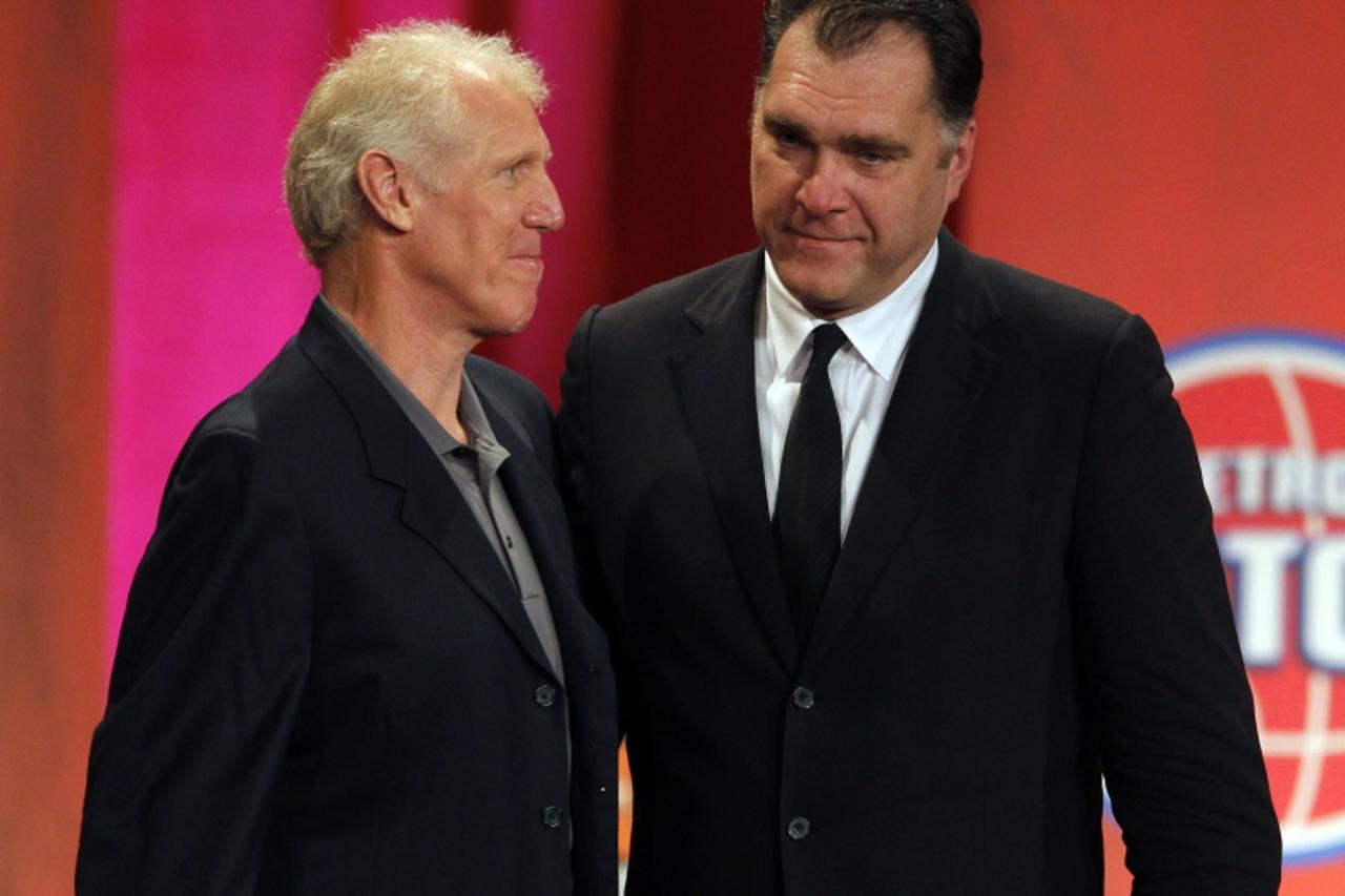 'Inductee Arvydas Sabonis (R) is congratulated by his presenter, Hall of Fame Player Bill Walton, during the Naismith Memorial Basketball Hall of Fame Class of 2011 Enshrinement Ceremony in Springfiel