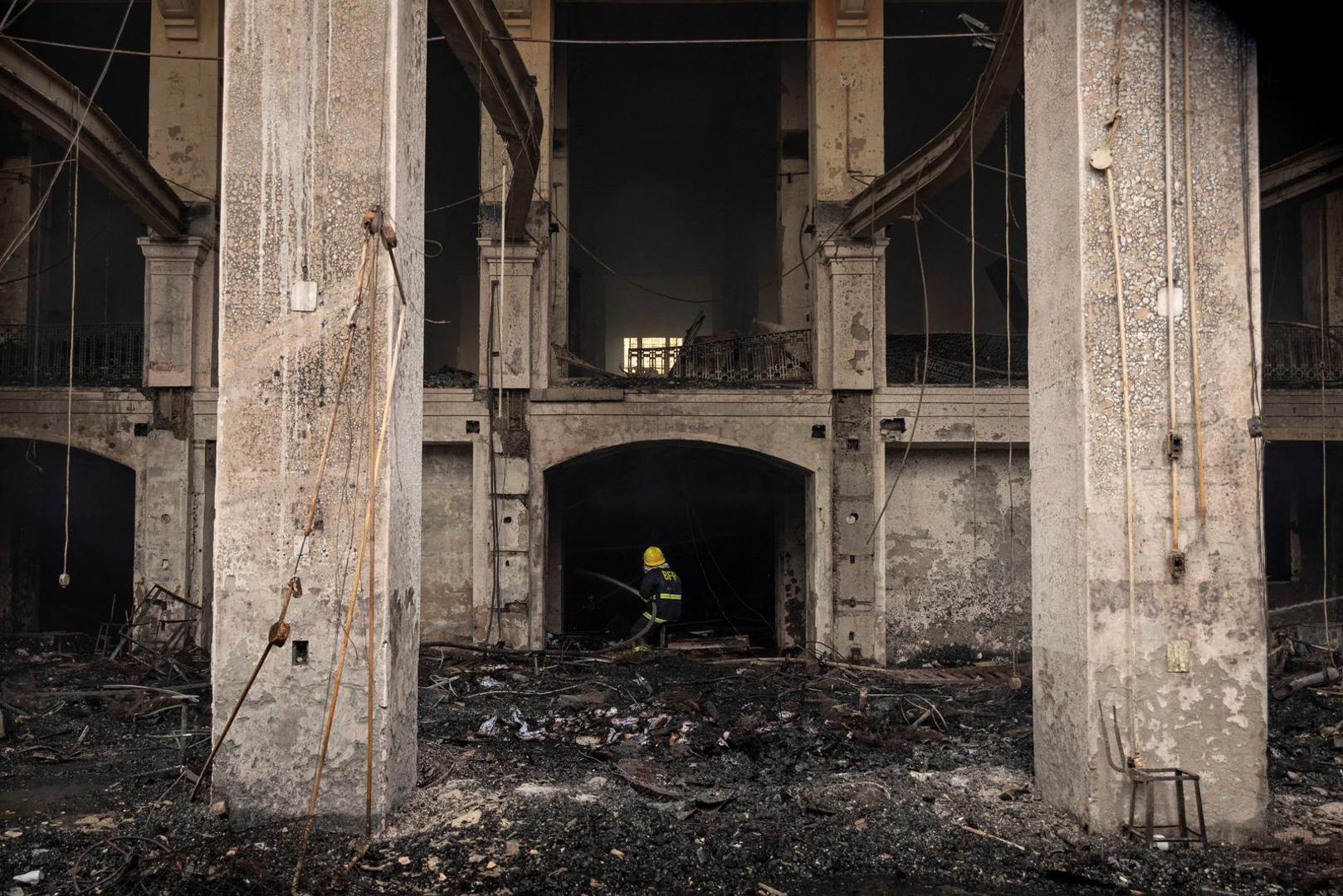 A firefighter extinguishes the inside of the burning Manila Central Post Office building after a massive fire, in Manila, Philippines, May 22, 2023. REUTERS/Eloisa Lopez Photo: ELOISA LOPEZ/REUTERS