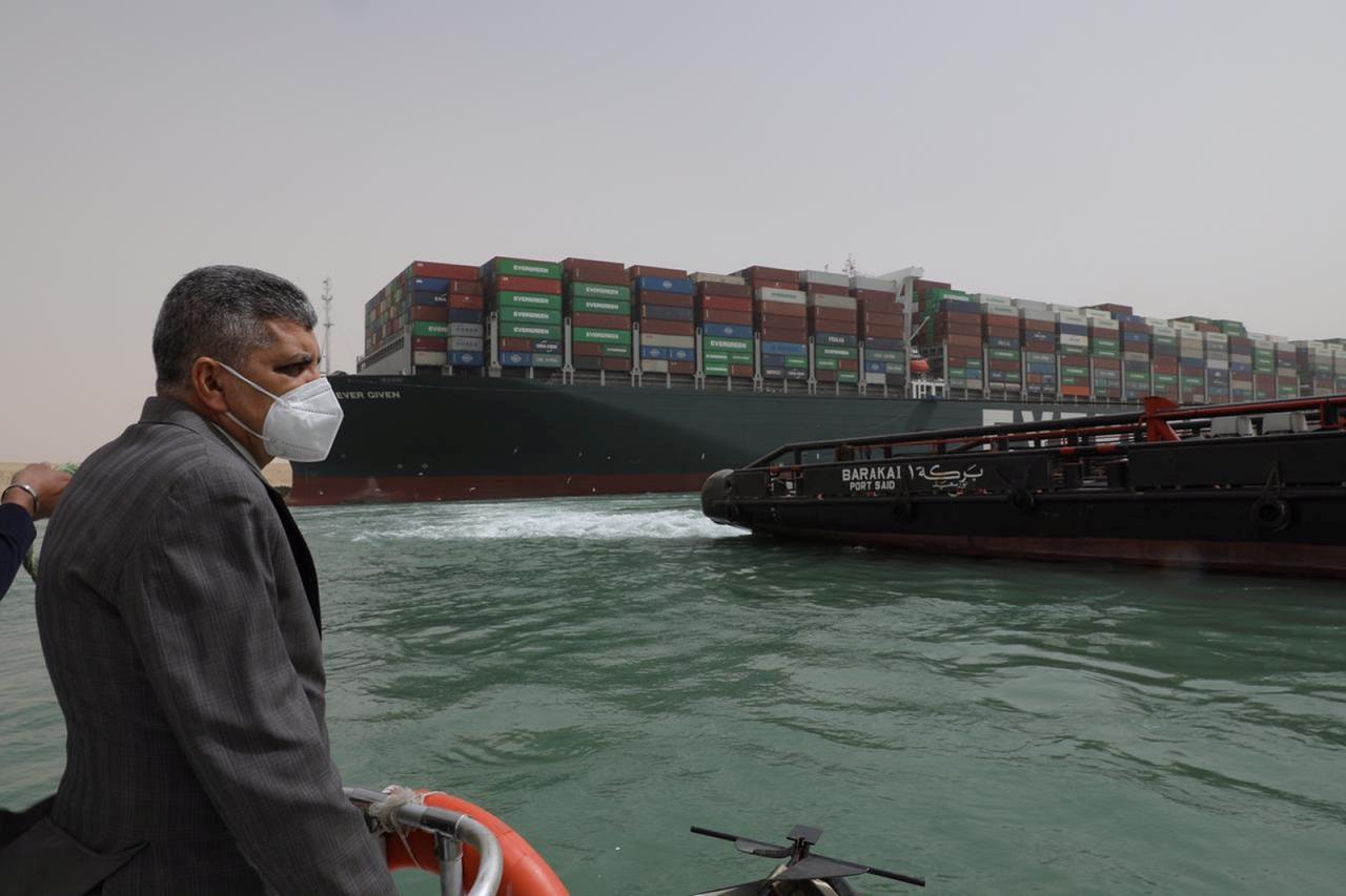 Osama Rabie, Chairman of the Suez Canal Authority, monitors the situation near stranded container ship Ever Given, one of the world's largest container ships, after it ran aground, in Suez Canal