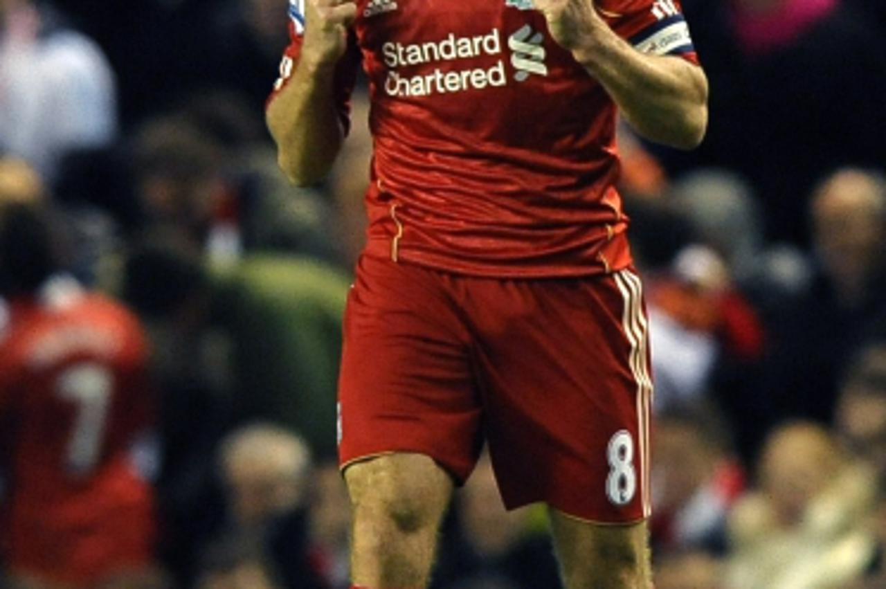 \'Liverpool\'s English midfielder Steven Gerrard celebrates after scoring during the English League cup semi final second leg football match between Liverpool and Manchester City at Anfield, in Liverp