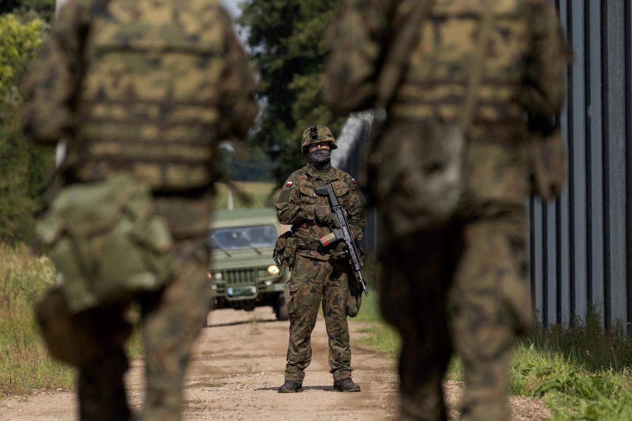 FILE PHOTO: Polish soldiers patrol the Polish-Belarusian border