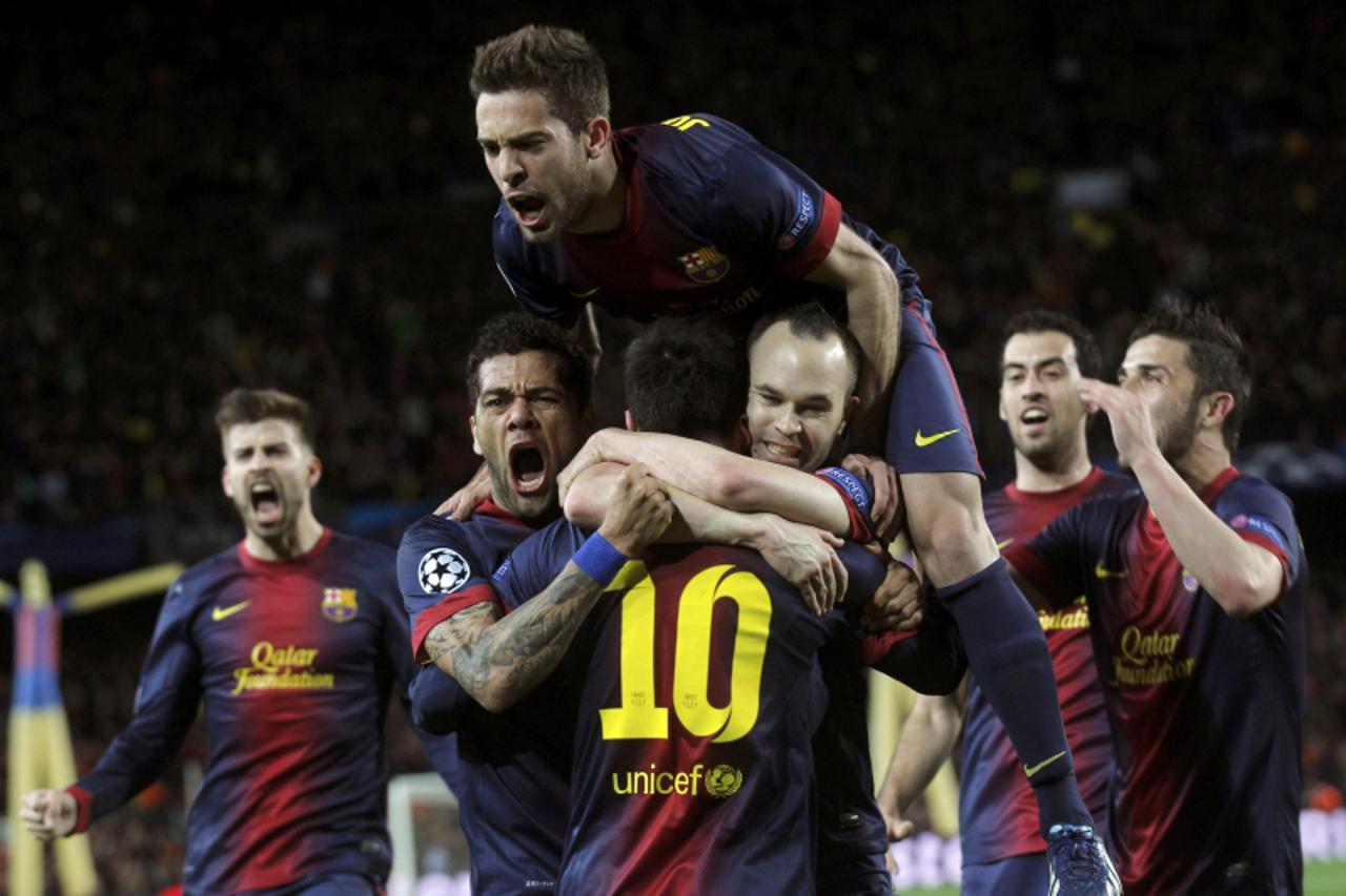 'Barcelona\'s Lionel Messi (10) is congratulated by team mates Dani Alves (L), Jordi Alba (top) and Andres Iniesta after scoring his second goal against AC Milan during their Champions League round of