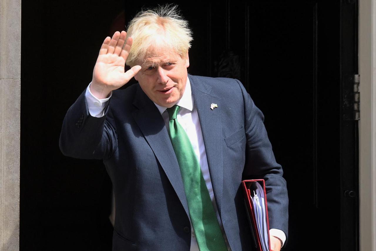 British PM Johnson walks outside Downing Street in London