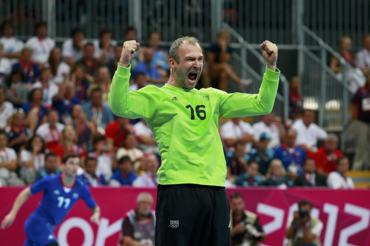 'France\'s Thierry Omeyer reacts after saving a penalty shot by Croatia during the men\'s semi-final match at the Basketball Arena during the London 2012 Olympic Games August 10, 2012.   REUTERS/Adree