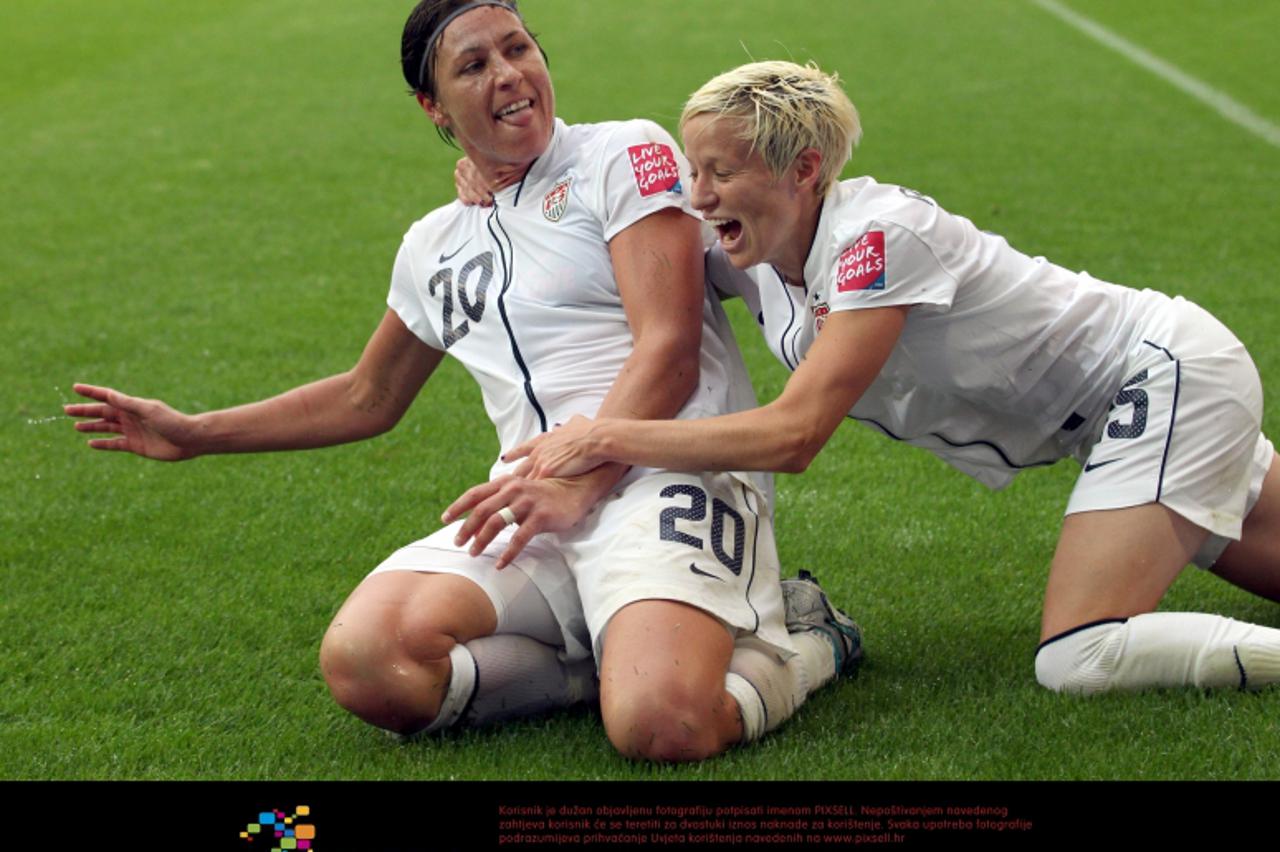 'Abby Wambach (L) of USA celebrates with team-mate Megan Rapinoe after scoring 1-2 during the semi-final soccer match of the FIFA Women\'s World Cup between France and the USA at the Borussia-Park sta