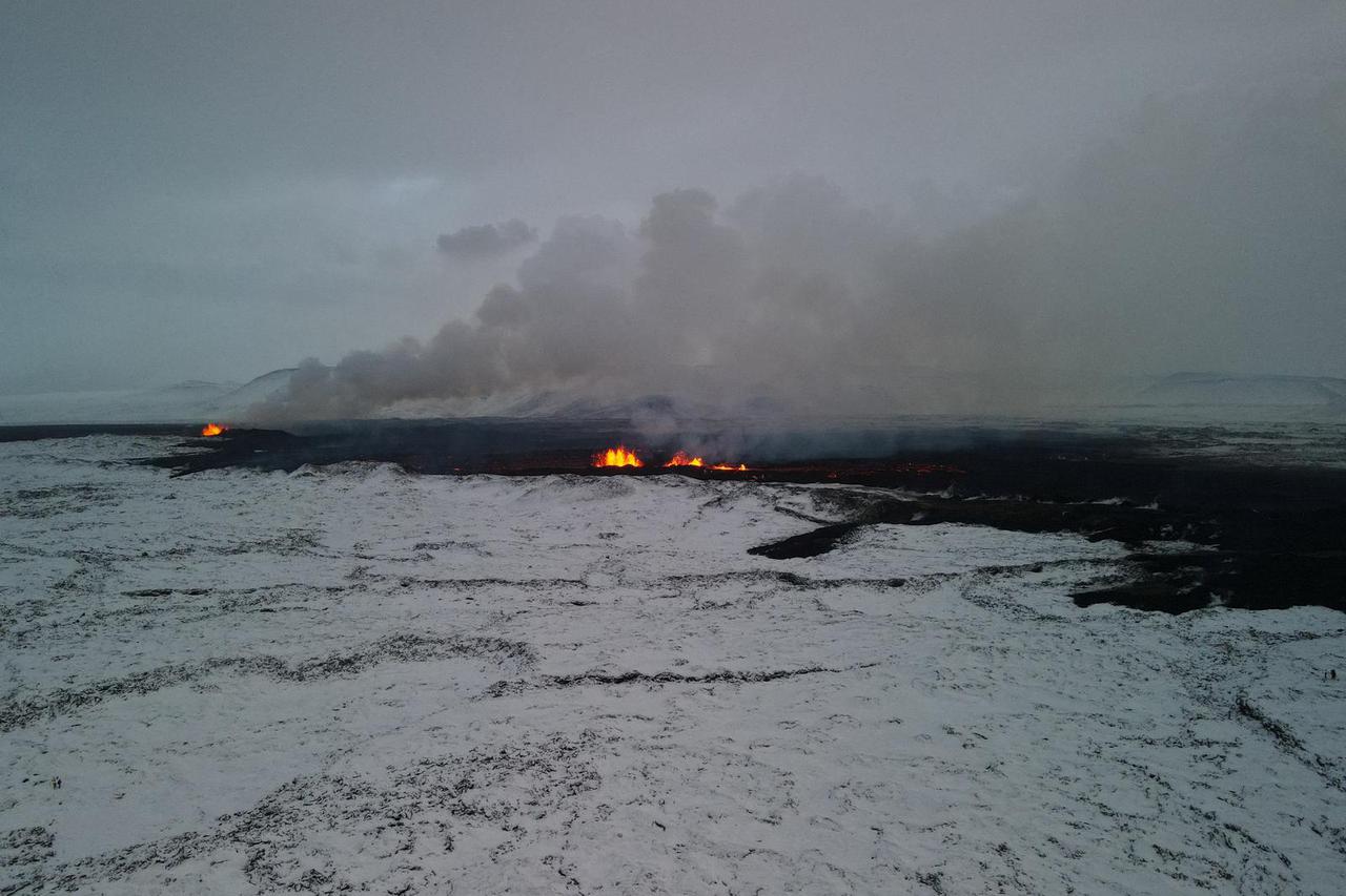 An aerial view of lava spewing from the site of the volcanic eruption north of Grindavik