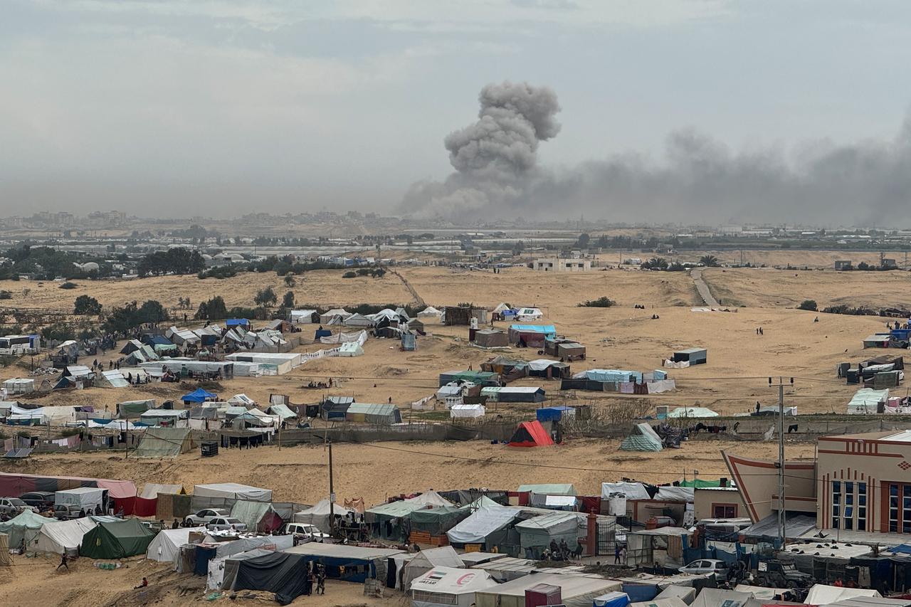 Smoke rises during an Israeli ground operation in Khan Younis, as seen from a tent camp sheltering displaced Palestinians in Rafah