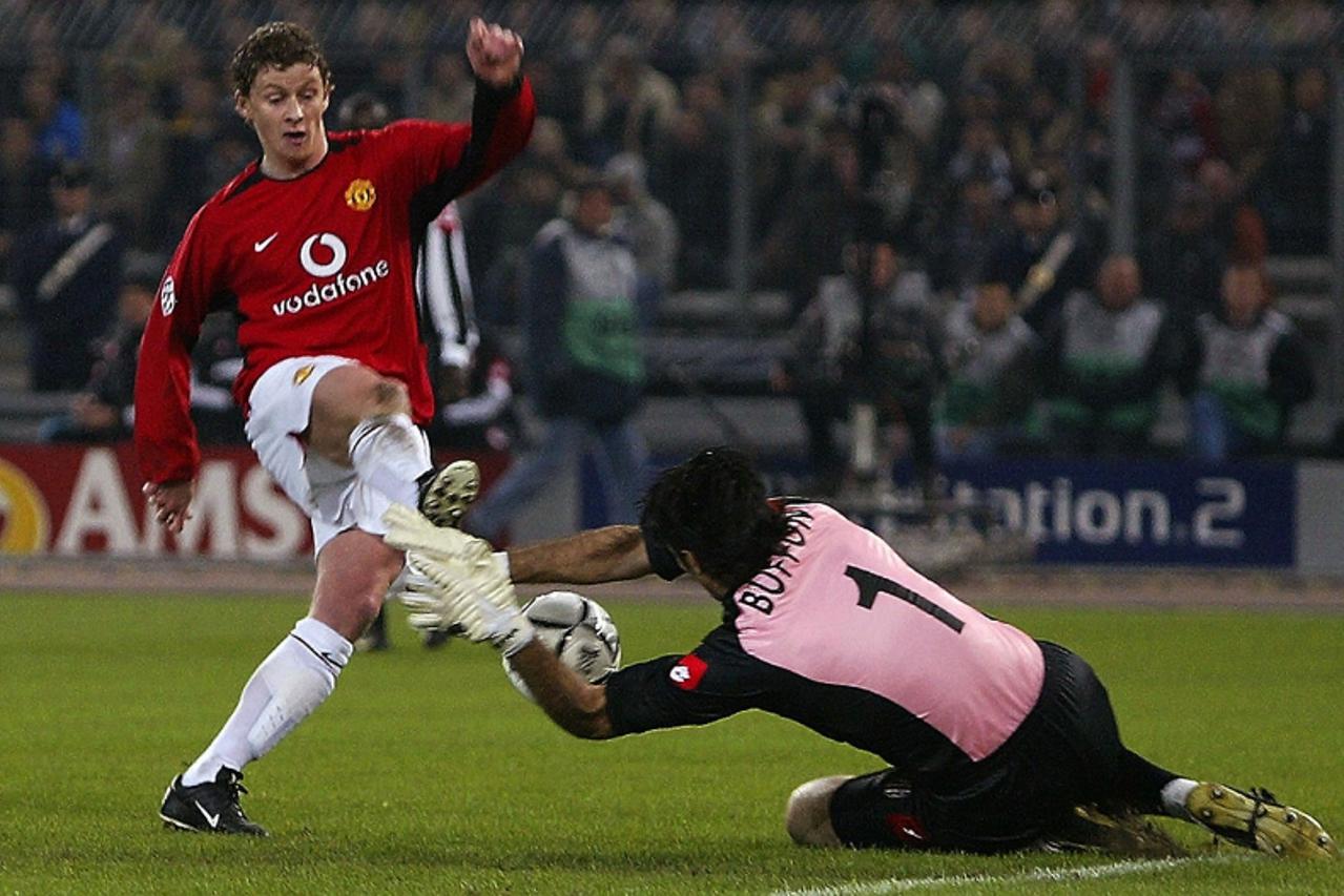 'EDITORS NOTE CORRECTING DATE - Manchester United\'s Norwegian striker Ole Gunnar Solskjaer (L) is blocked by Juventus\' goalkeeper Gianluigi Buffon (R)   in their Champions League phase two group D m