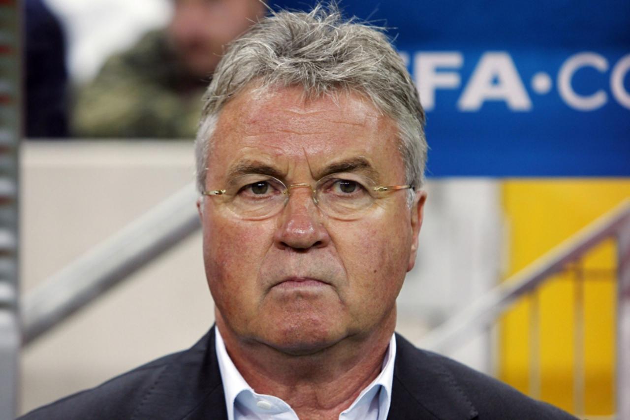 'Turkey\'s head coach Guus Hiddink looks on before the start of his team\'s Euro 2012 qualifying Group A soccer match against Azerbaijan at Turk Telekom Arena in Istanbul October 11, 2011. REUTERS/Osm